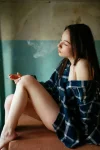 half-naked-woman-sitting-on-a-table-with-a-cigarette[1].webp