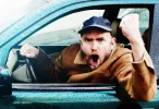 furious-male-driver-yelling-shaking-fist-through-window[1].webp